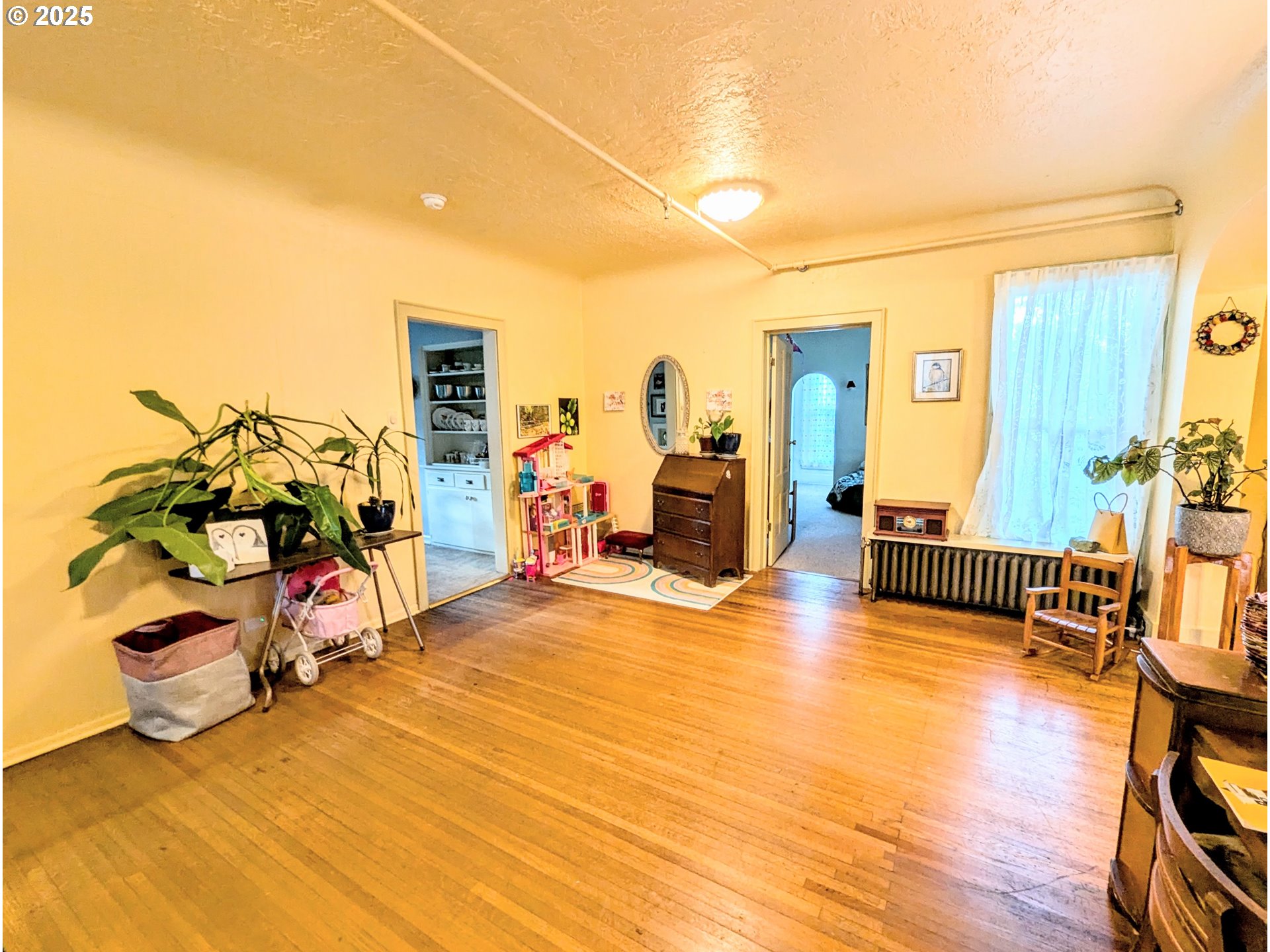 1802 3rd Street La Grande, OR 97850 - Photo 6 of 21 a view of a livingroom with furniture and a flat screen tv