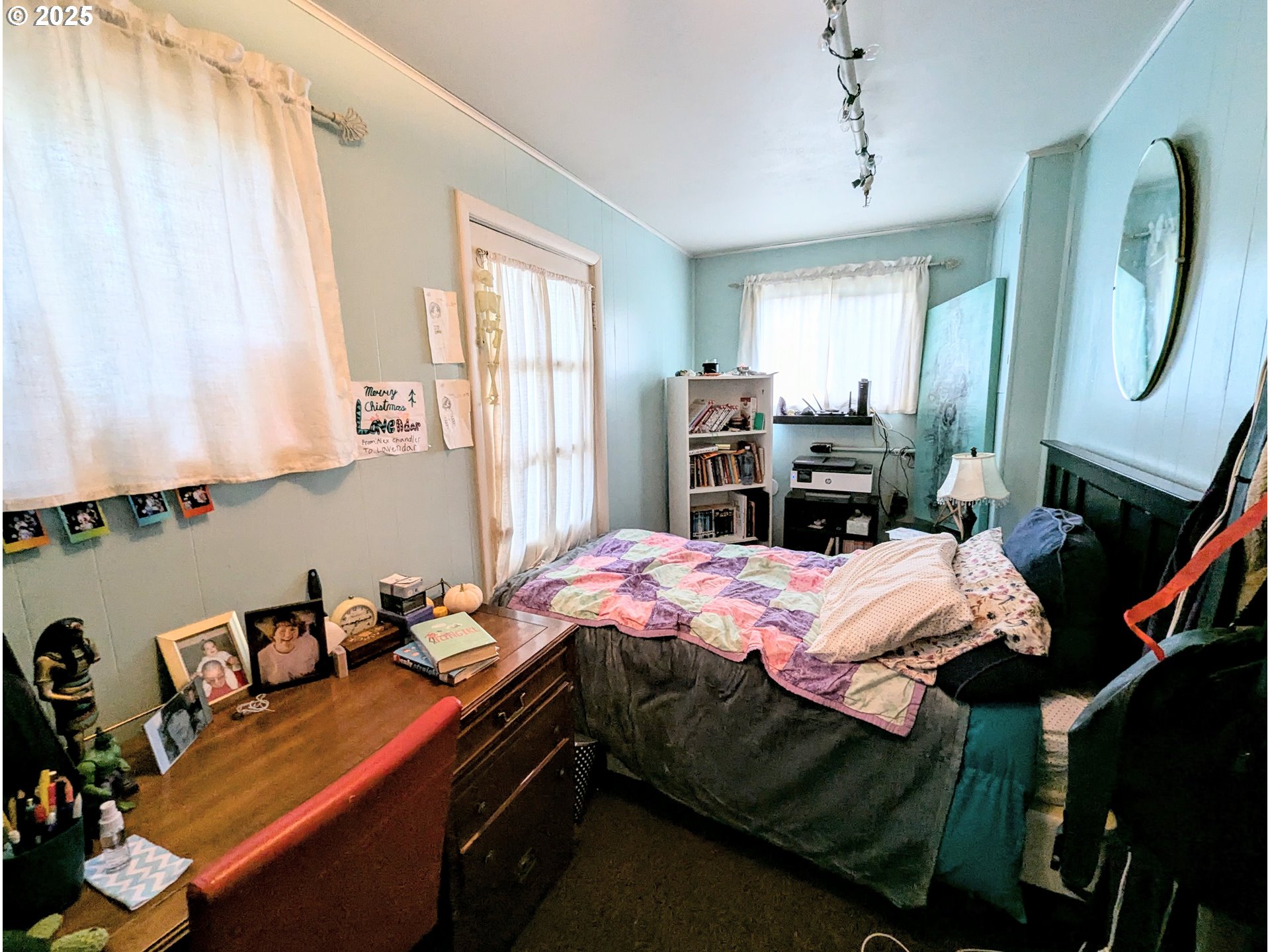 1802 3rd Street La Grande, OR 97850 - Photo 10 of 21 a bed room with a bed and a chair