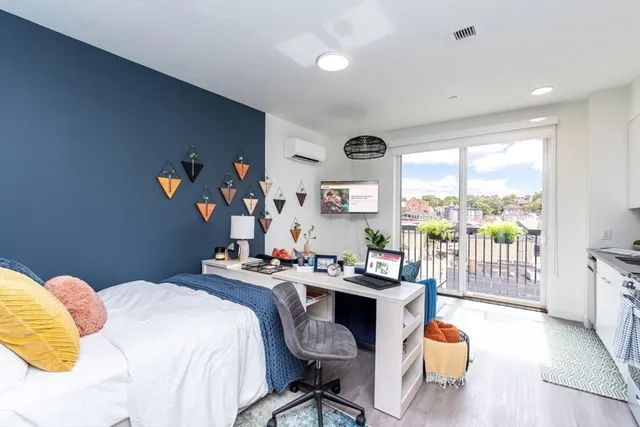 a bedroom with a bed and a table