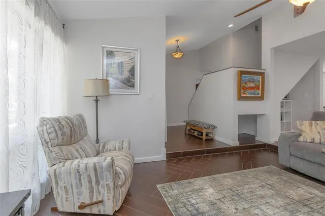 a kitchen with stainless steel appliances granite countertop a sink dishwasher a refrigerator a microwave oven with granite countertops and cabinets