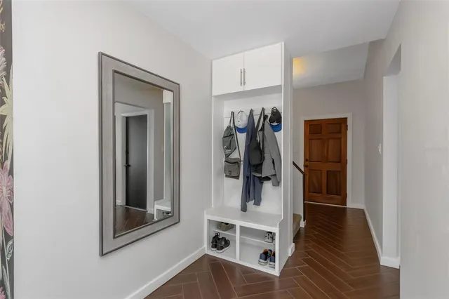 a kitchen with stainless steel appliances a sink stove and cabinets