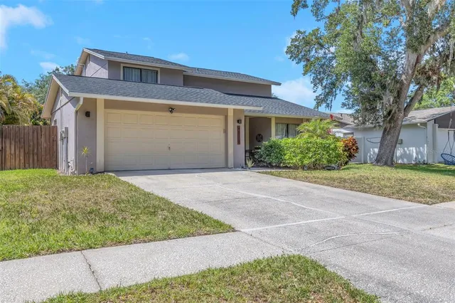 an aerial view of house with yard