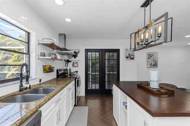 a dining room with wooden floor and a table