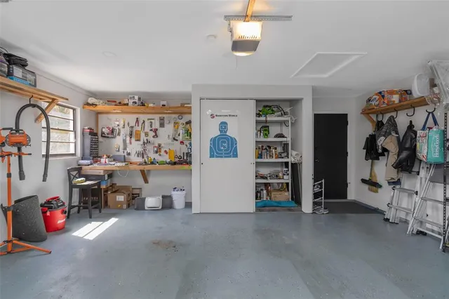 a view of a house with backyard porch and sitting area