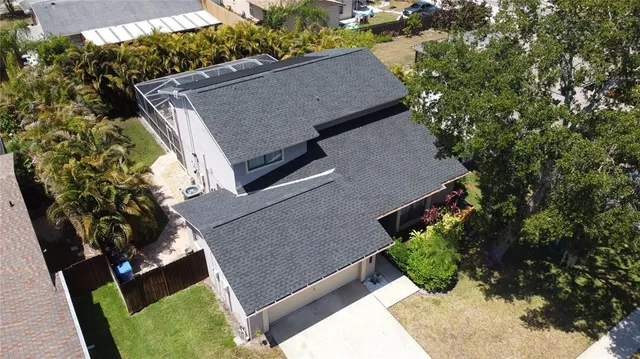 a view of a livingroom with furniture and a window