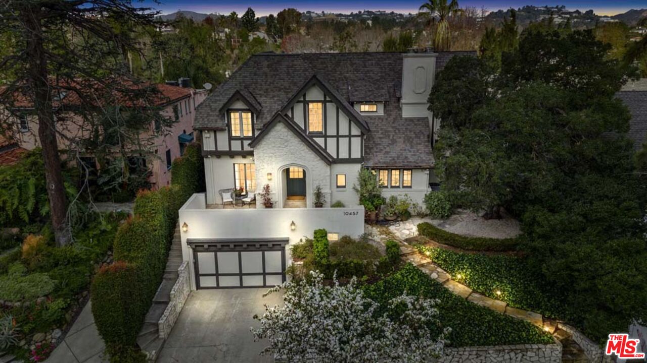a view of house with yard and green space