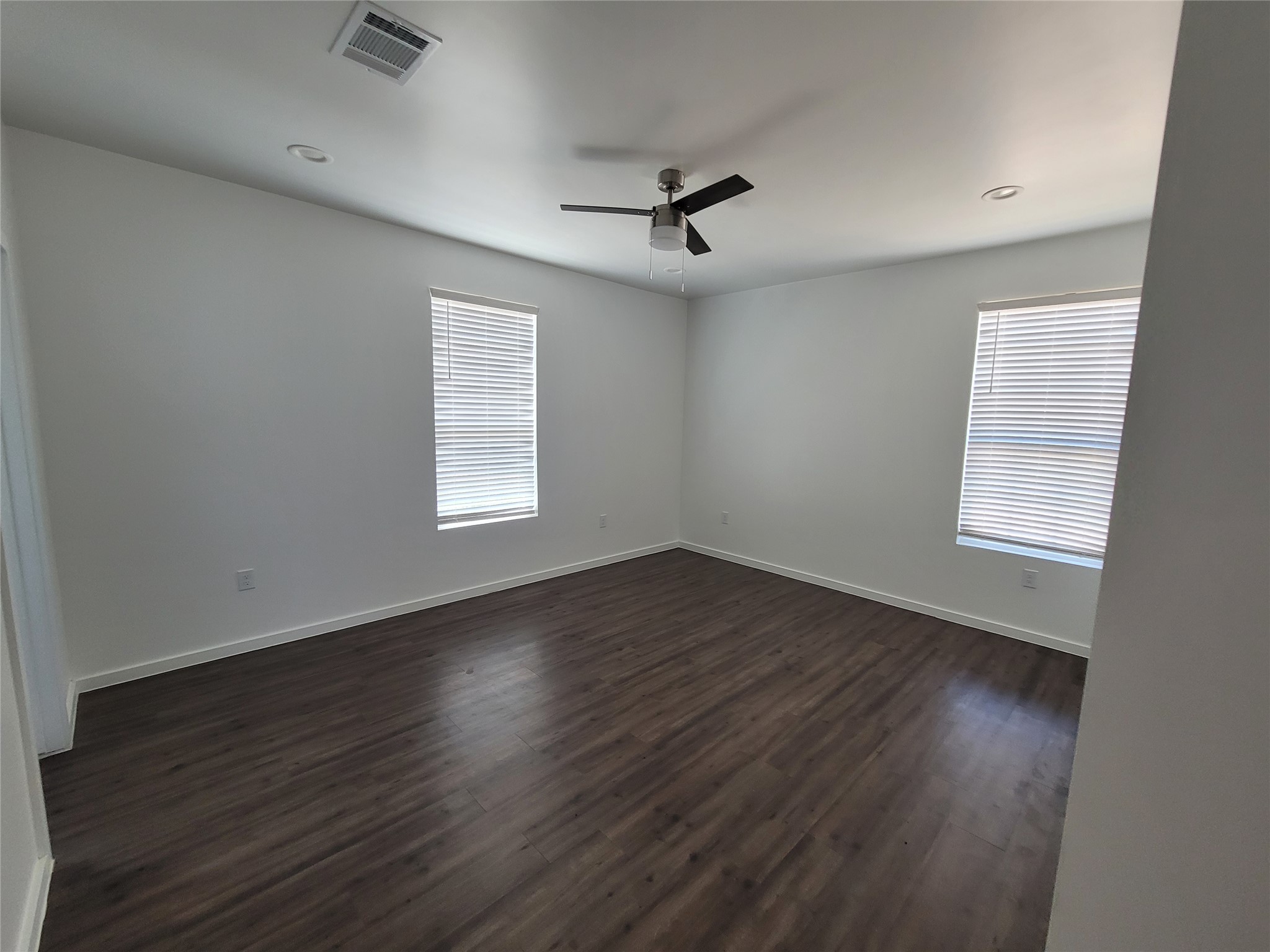 422 A Road Stockdale, TX 78160 - Photo 23 of 40 Rich hardwood-style flooring and abundant natural light define this inviting sleeping space.