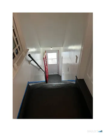a black and white photo of a living room