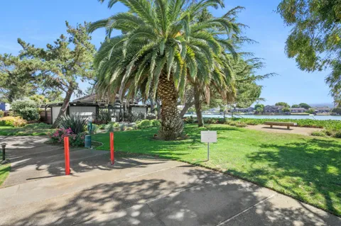 a view of a balcony with wooden floor