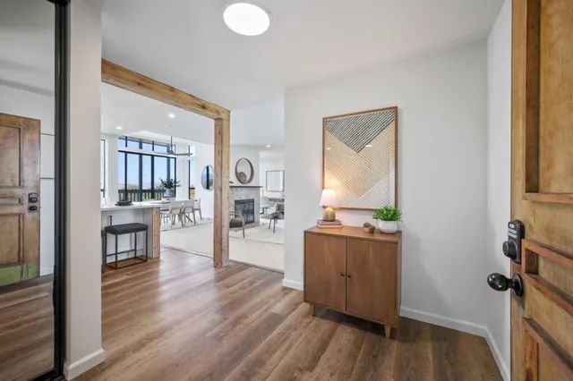 a kitchen with stainless steel appliances a refrigerator sink and white cabinets
