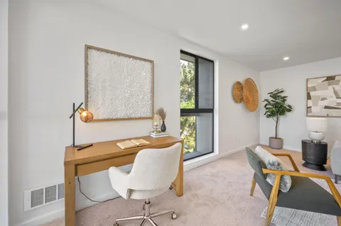a white toilet sitting next to a bath tub