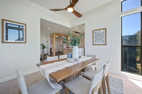 a bedroom with a bed and a wall painting