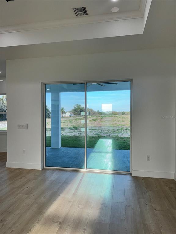 1721 McClellan Road Frostproof, FL 33843 - Photo 16 of 41 a view of empty room with floor to ceiling window