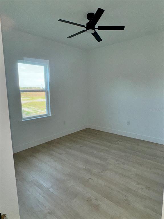 1721 McClellan Road Frostproof, FL 33843 - Photo 20 of 41 a view of an empty room with a window