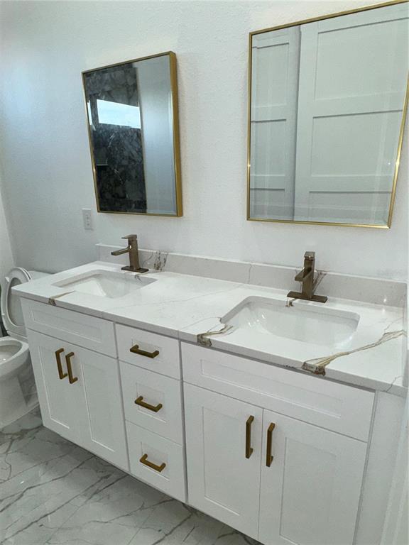 1721 McClellan Road Frostproof, FL 33843 - Photo 25 of 41 a bathroom with a sink and a mirror