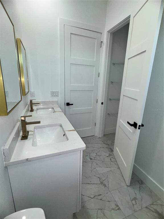 1721 McClellan Road Frostproof, FL 33843 - Photo 28 of 41 a bathroom with a sink toilet and shower