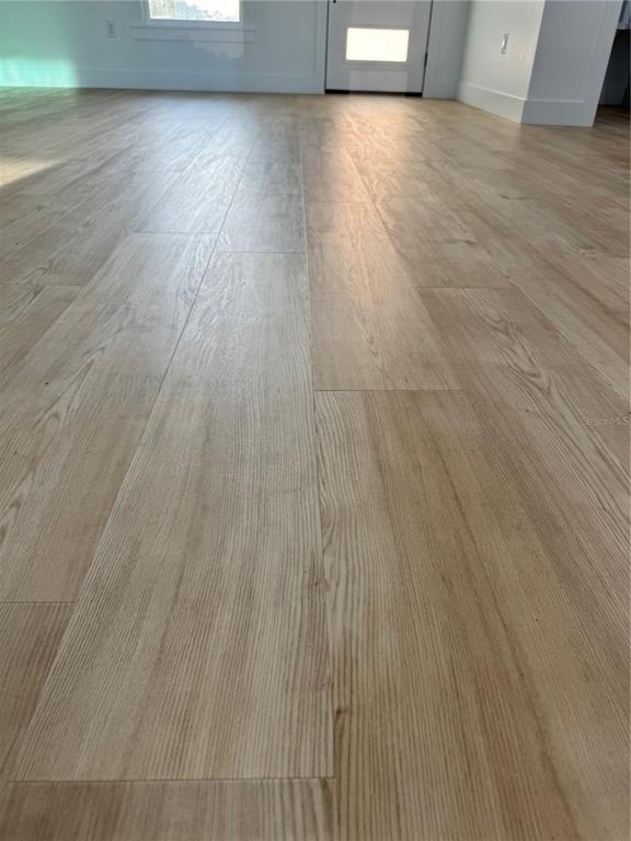 1721 McClellan Road Frostproof, FL 33843 - Photo 30 of 41 a view of a room with wooden floor