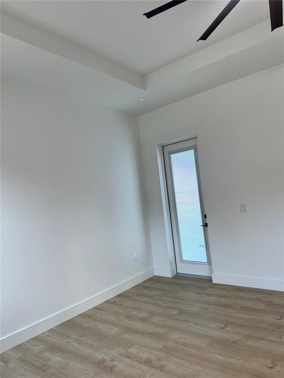 1721 McClellan Road Frostproof, FL 33843 - Photo 33 of 41 a view of a room with wooden floor and window