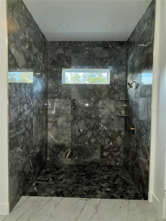 1721 McClellan Road Frostproof, FL 33843 - Photo 35 of 41 a bathroom with a shower