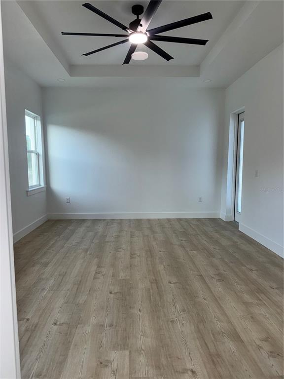1721 McClellan Road Frostproof, FL 33843 - Photo 37 of 41 an empty room with windows and fan