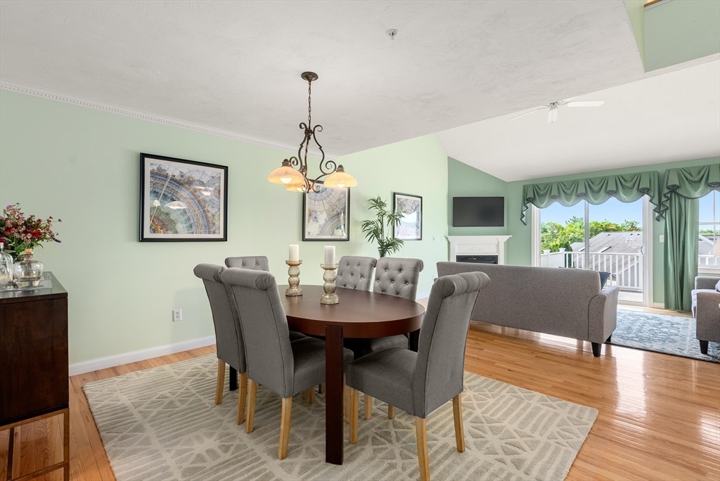 5 Strawberry Lane, Unit E Hudson, MA 01749 - Photo 13 of 42 a view of a dining room with furniture window and wooden floor