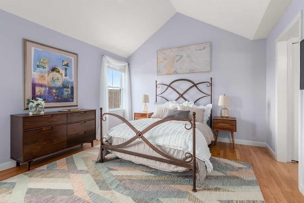 5 Strawberry Lane, Unit E Hudson, MA 01749 - Photo 17 of 42 a bedroom with a bed and a dresser