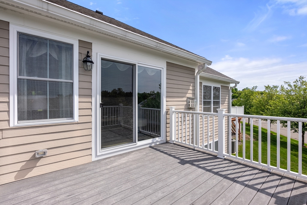 5 Strawberry Lane, Unit E Hudson, MA 01749 - Photo 31 of 42 a view of a house with wooden floor