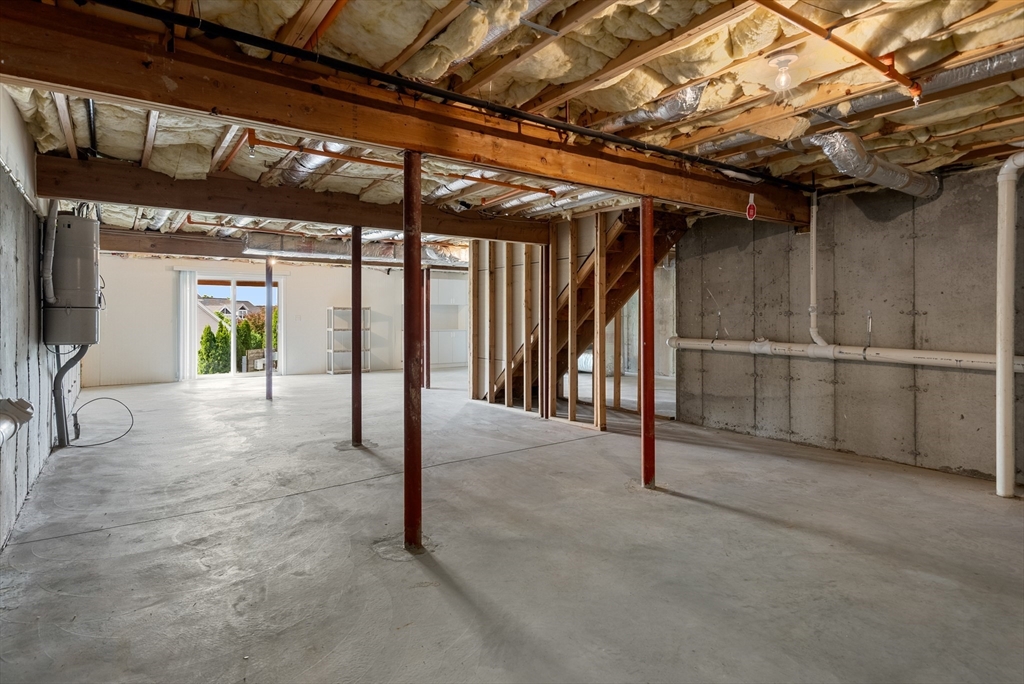 5 Strawberry Lane, Unit E Hudson, MA 01749 - Photo 33 of 42 a view of an empty room with wooden floor