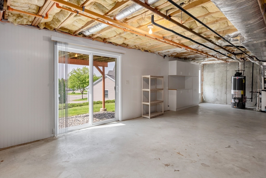 5 Strawberry Lane, Unit E Hudson, MA 01749 - Photo 34 of 42 a view of empty room with wooden floor and windows