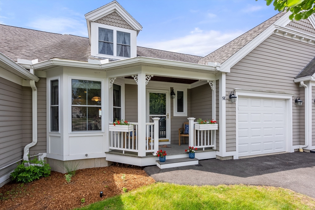 5 Strawberry Lane, Unit E Hudson, MA 01749 - Photo 36 of 42 front view of a house with a yard