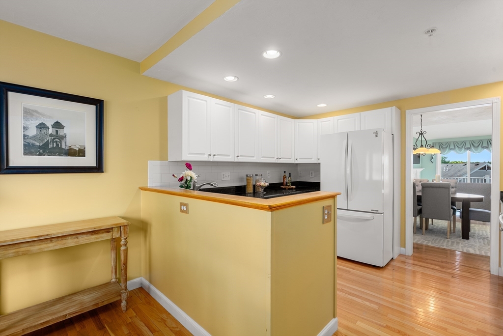 5 Strawberry Lane, Unit E Hudson, MA 01749 - Photo 8 of 42 a kitchen with stainless steel appliances a refrigerator and a stove top oven
