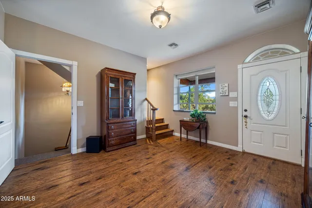 a view of a chairs and a table in a patio