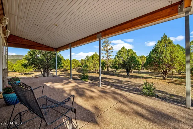 a bathroom with a sink a toilet a mirror and shower