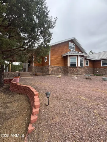 a view of a dining room that has a table and a chair