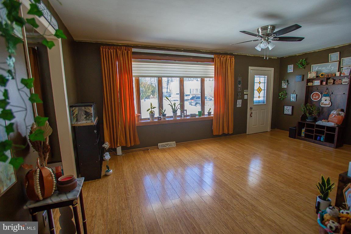 1232 Harding Road Vineland, NJ 08361 - Photo 13 of 29 wooden floor in an empty room with a window