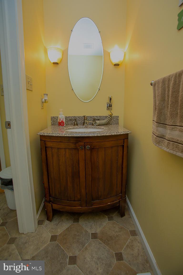 1232 Harding Road Vineland, NJ 08361 - Photo 18 of 29 a bathroom with a sink and a mirror