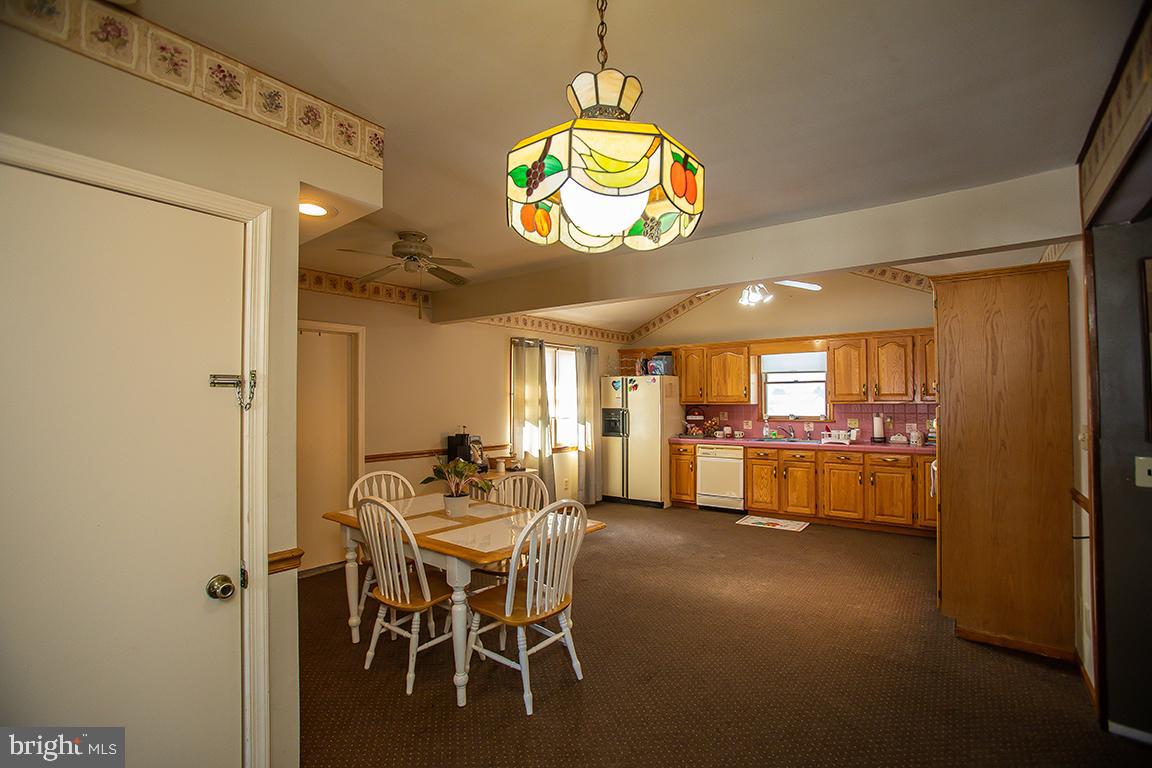1232 Harding Road Vineland, NJ 08361 - Photo 19 of 29 a view of a dining room with furniture and a chandelier