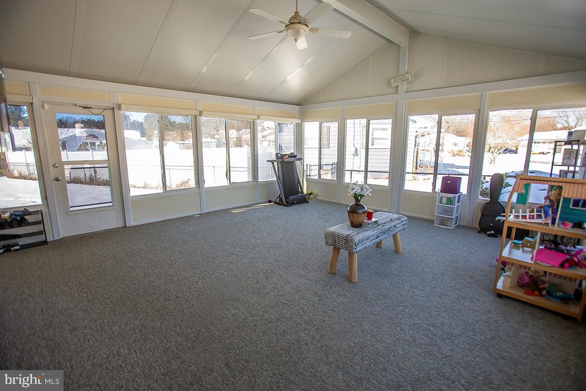 1232 Harding Road Vineland, NJ 08361 - Photo 23 of 29 a living room with furniture and floor to ceiling windows