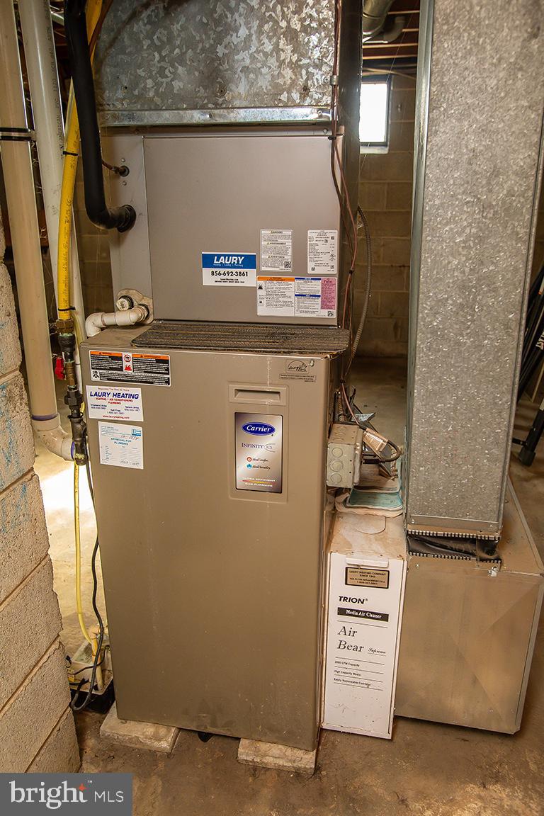 1232 Harding Road Vineland, NJ 08361 - Photo 26 of 29 a room with water heater and storage