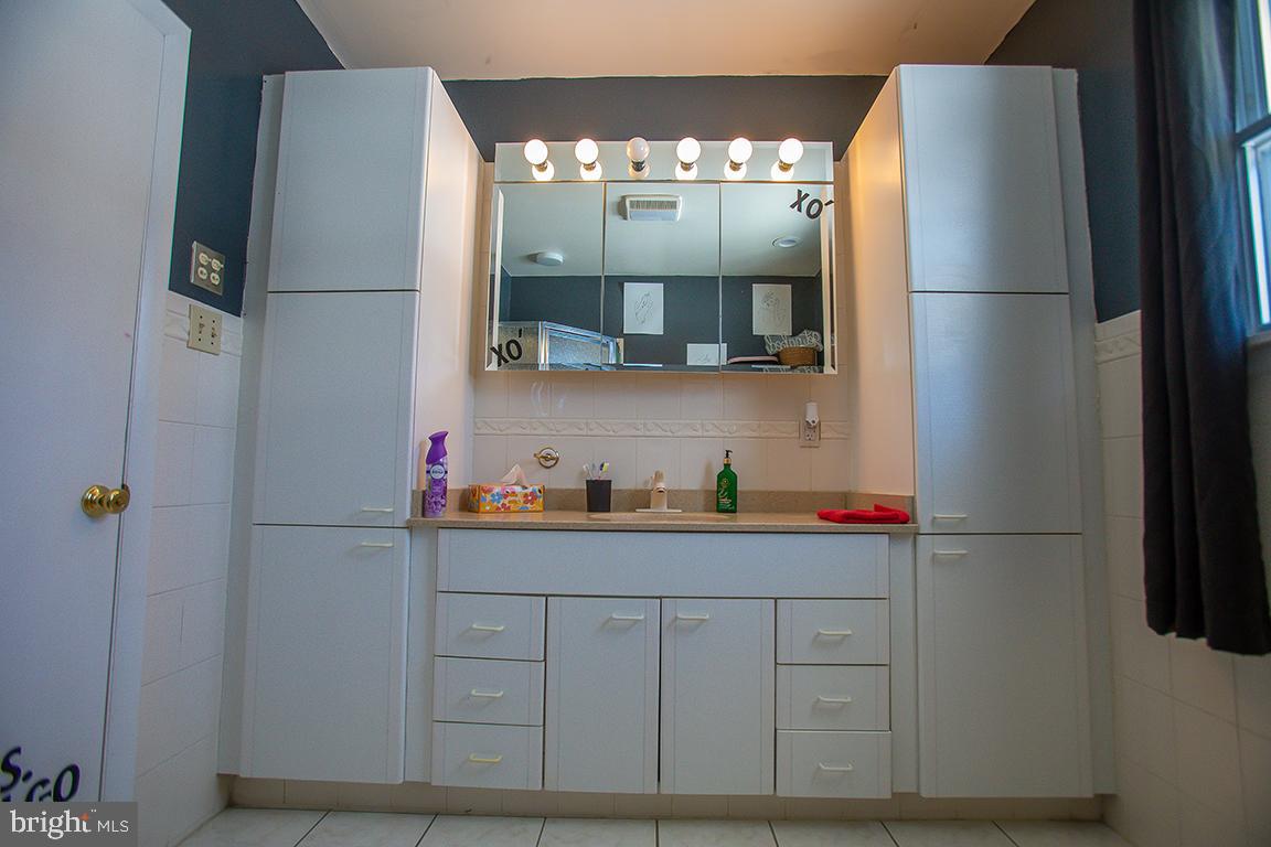 1232 Harding Road Vineland, NJ 08361 - Photo 3 of 29 a kitchen with a refrigerator and cabinets
