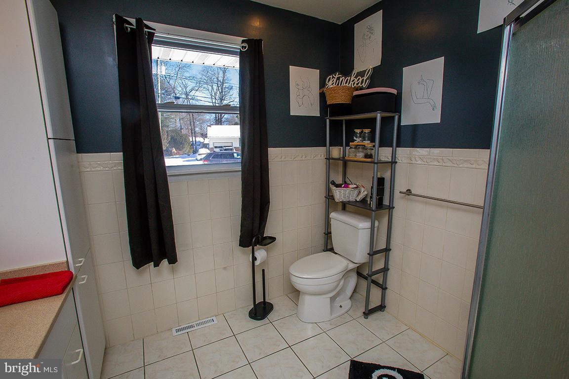 1232 Harding Road Vineland, NJ 08361 - Photo 5 of 29 a bathroom with sink toilet and mirror
