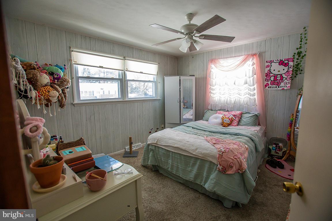 1232 Harding Road Vineland, NJ 08361 - Photo 6 of 29 a bedroom with a bed and a chandelier