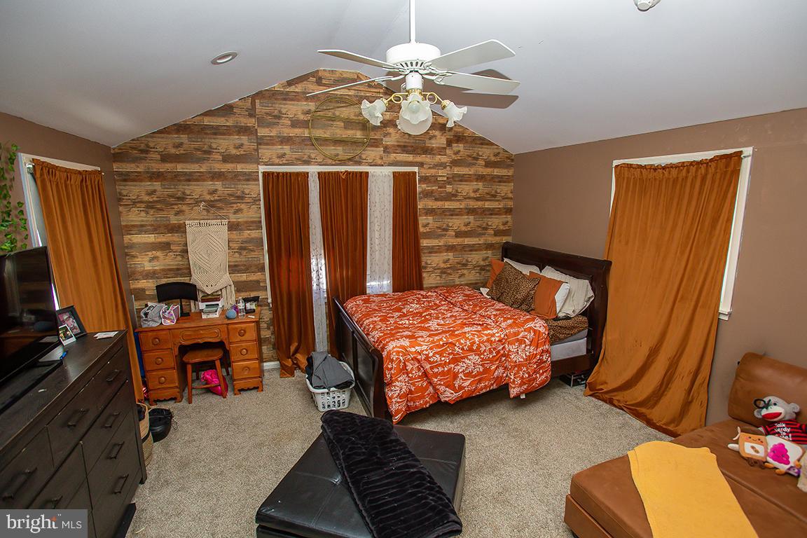 1232 Harding Road Vineland, NJ 08361 - Photo 8 of 29 a bedroom with a bed dresser and a window