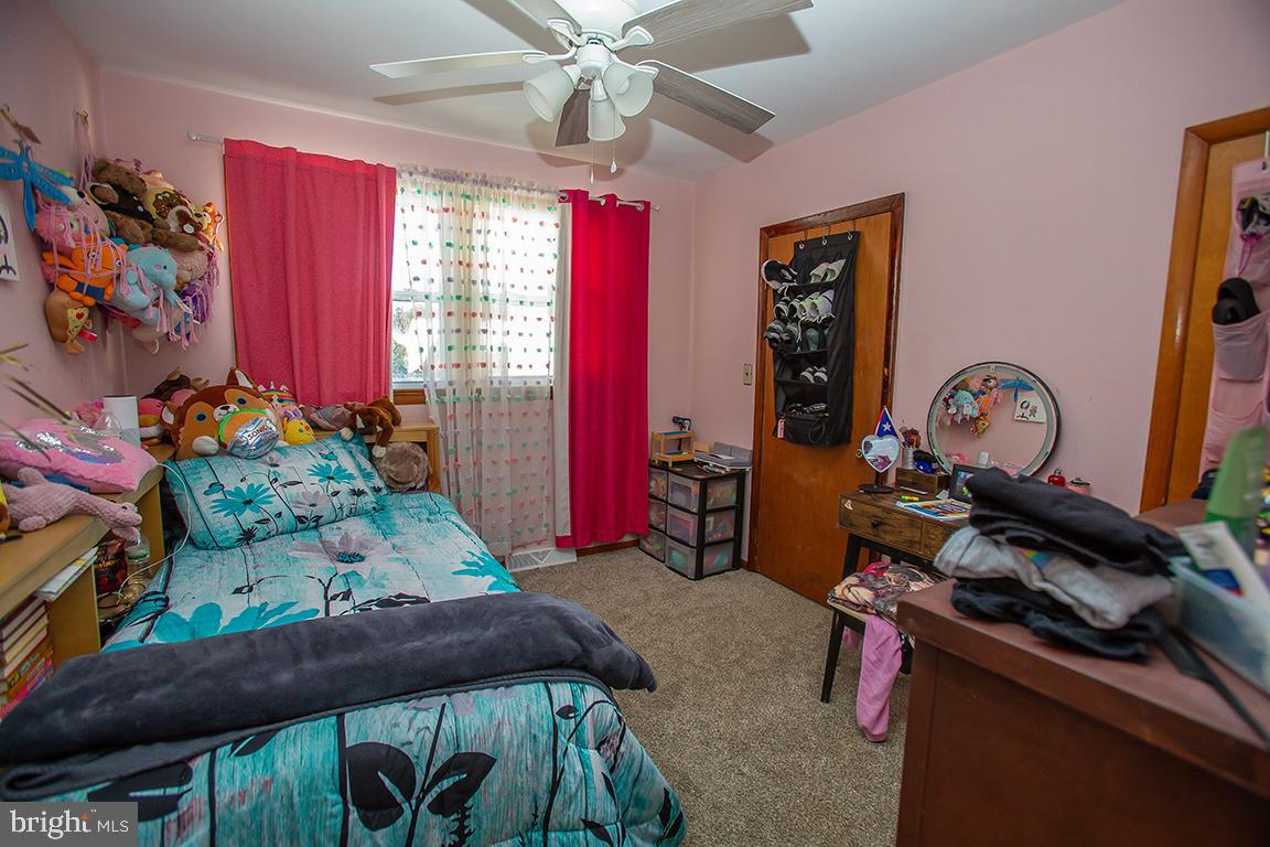 1232 Harding Road Vineland, NJ 08361 - Photo 10 of 29 a bedroom with furniture and a baby crib
