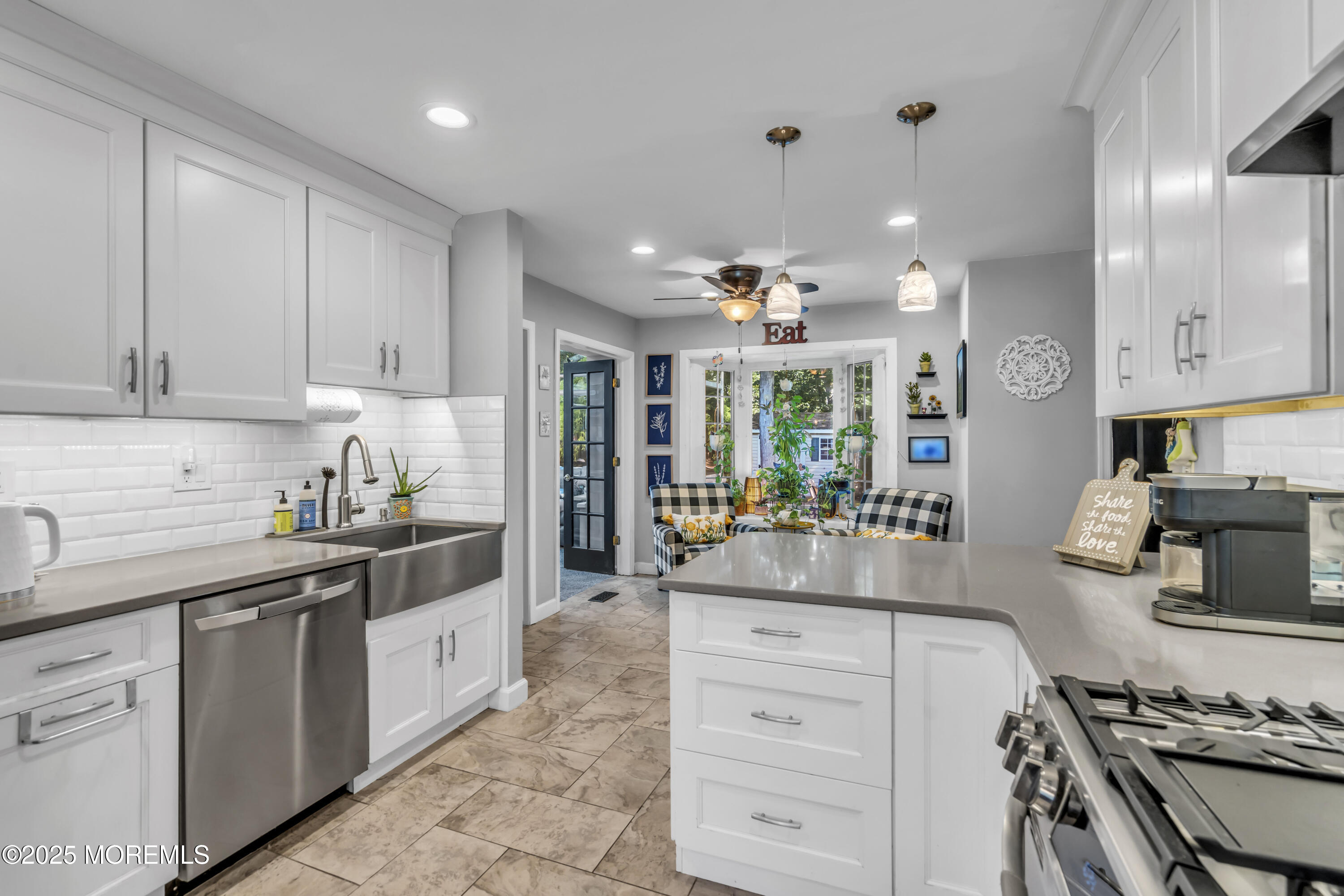 1 Sun Hollow Road Howell, NJ 07731 - Photo 12 of 47 a kitchen with kitchen island granite countertop a sink stove and cabinets