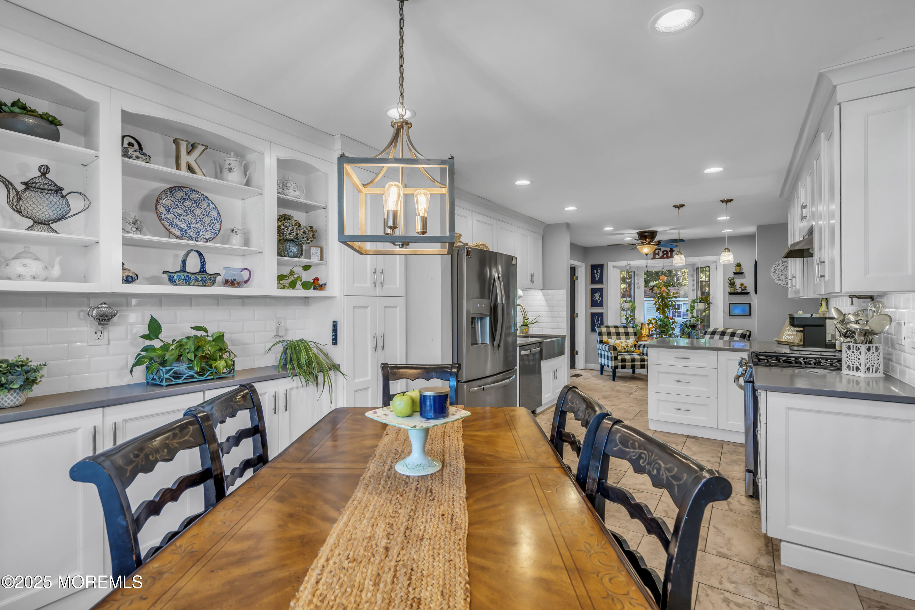 1 Sun Hollow Road Howell, NJ 07731 - Photo 15 of 47 a dining room with stainless steel appliances furniture a chandelier and a view of kitchen