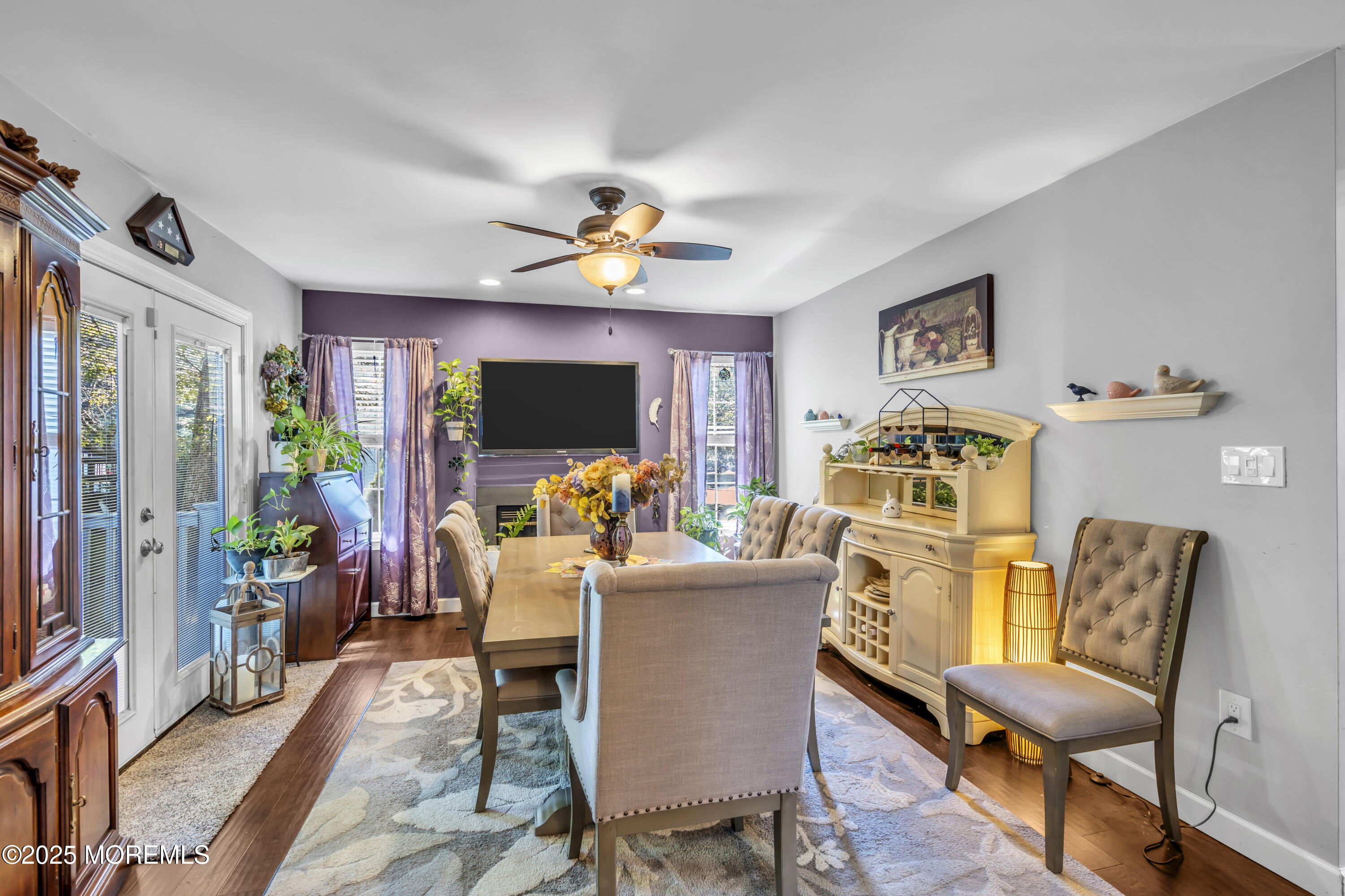 1 Sun Hollow Road Howell, NJ 07731 - Photo 17 of 47 a living room with furniture a flat screen tv and a window
