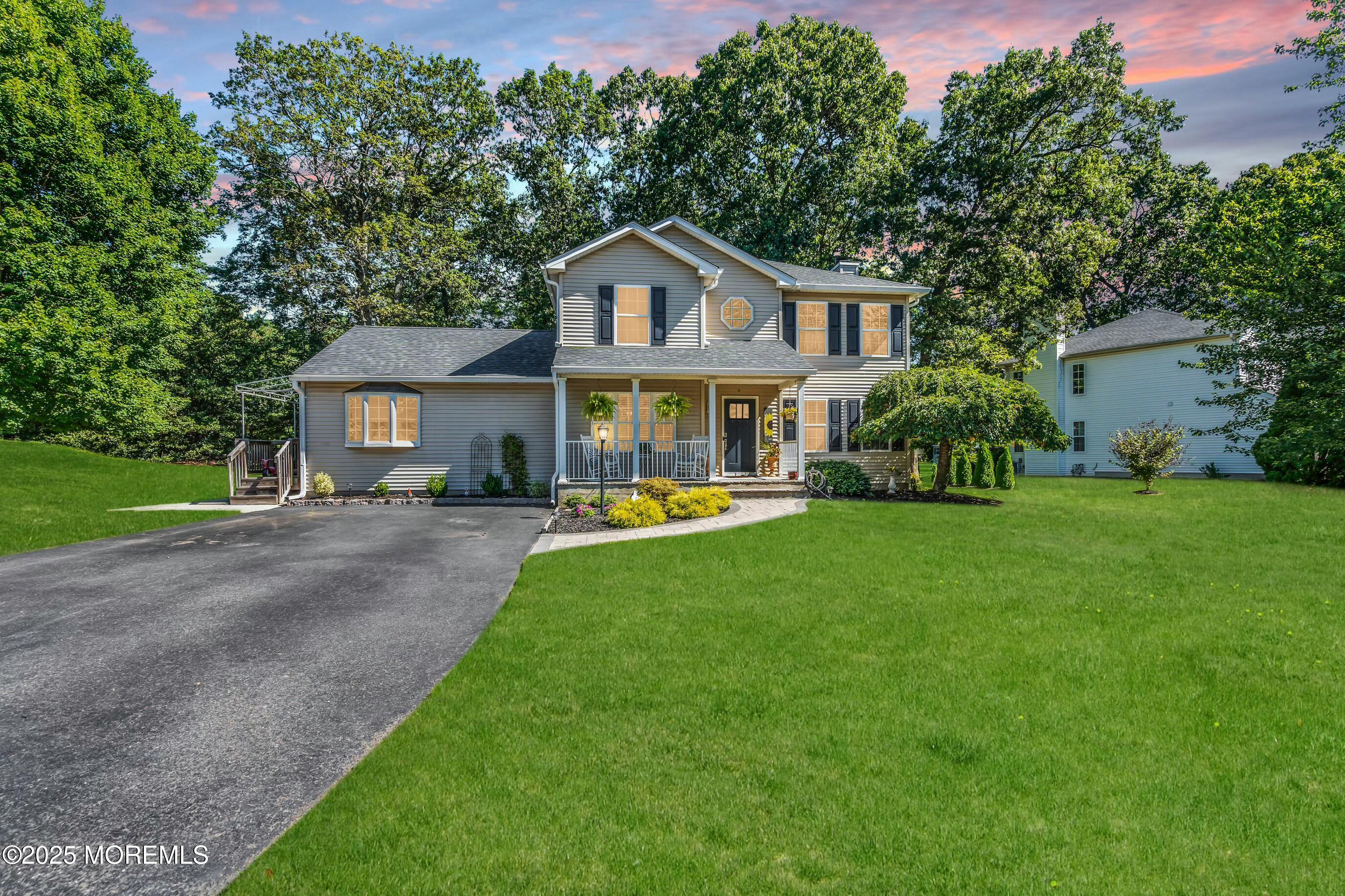 1 Sun Hollow Road Howell, NJ 07731 - Photo 2 of 47 a front view of house with yard and green space