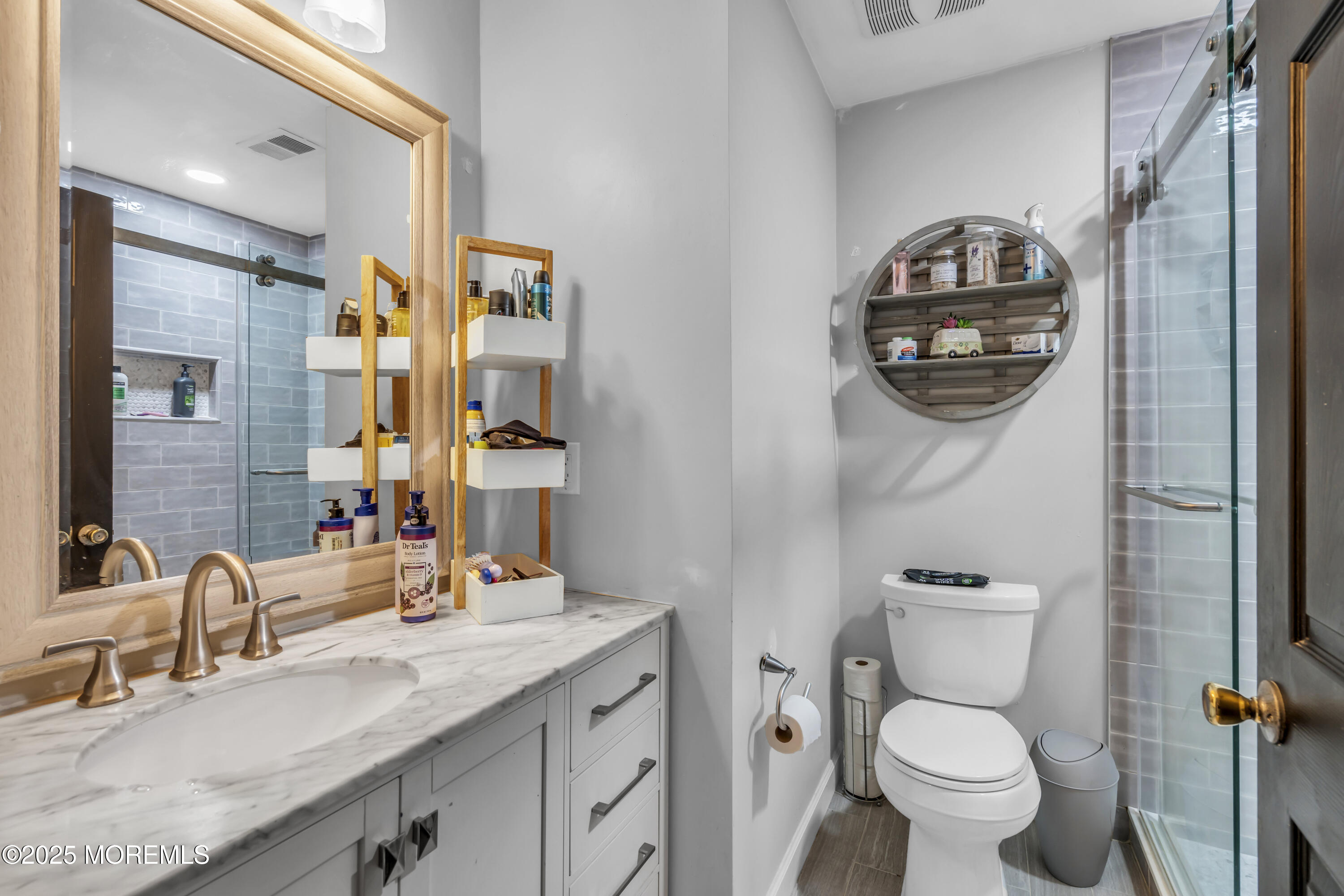 1 Sun Hollow Road Howell, NJ 07731 - Photo 21 of 47 a bathroom with a toilet sink and mirror
