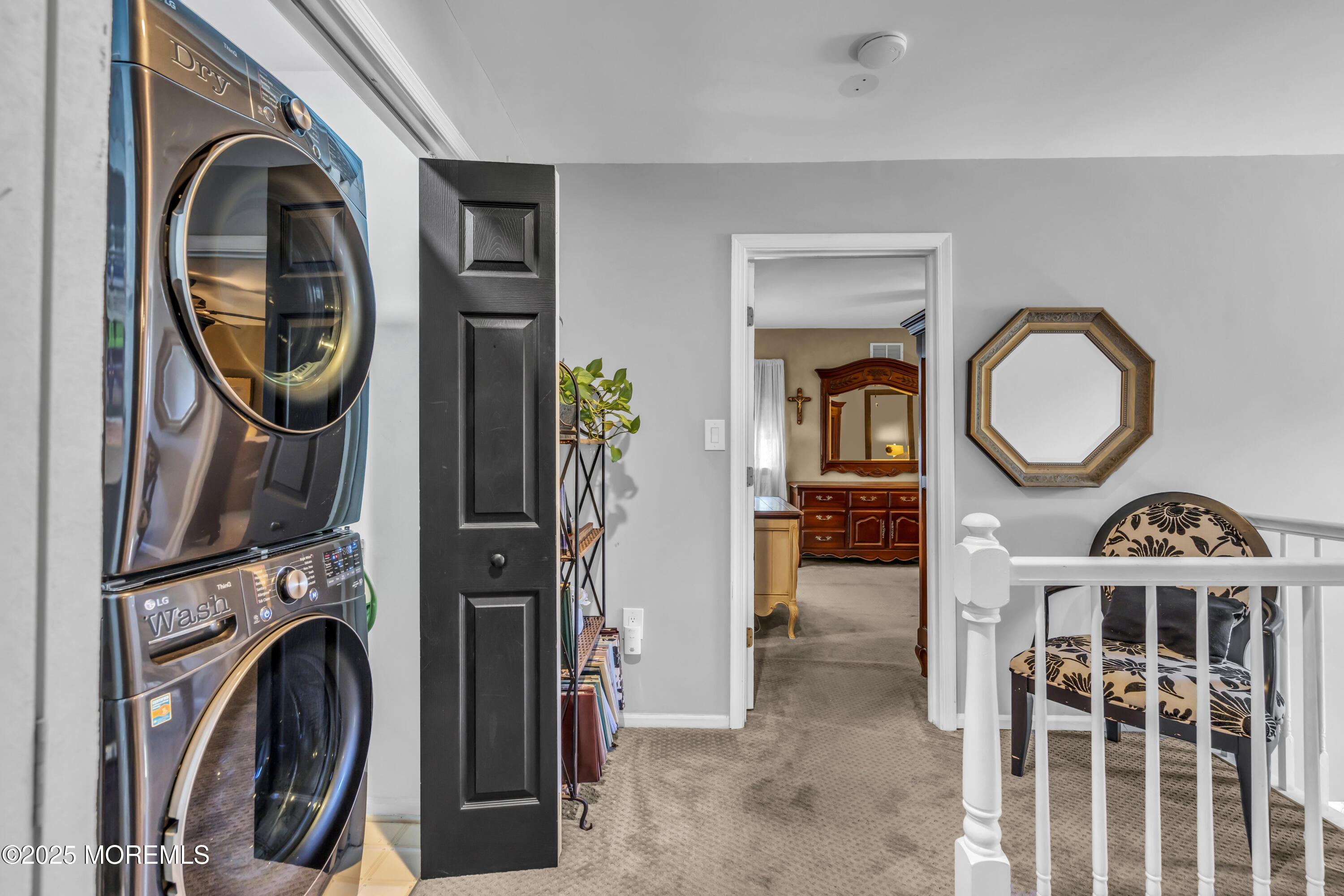 1 Sun Hollow Road Howell, NJ 07731 - Photo 22 of 47 a view of a hallway with washer and dryer